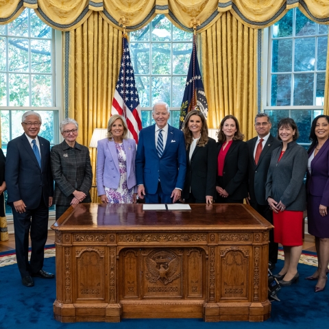 President Biden standing with other leaders after signing the Women's Health Research Initiative