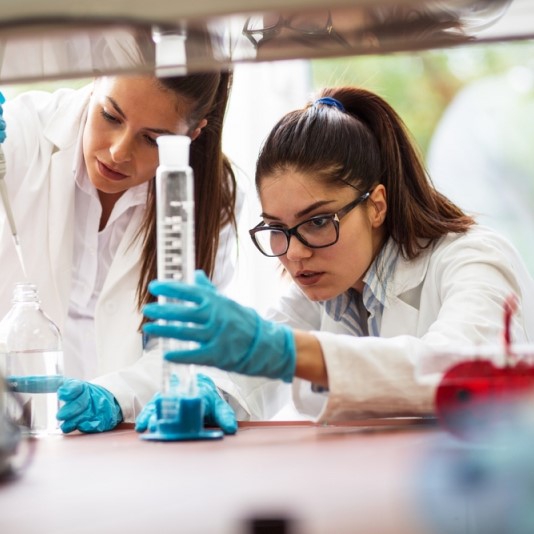 Two young women scientists