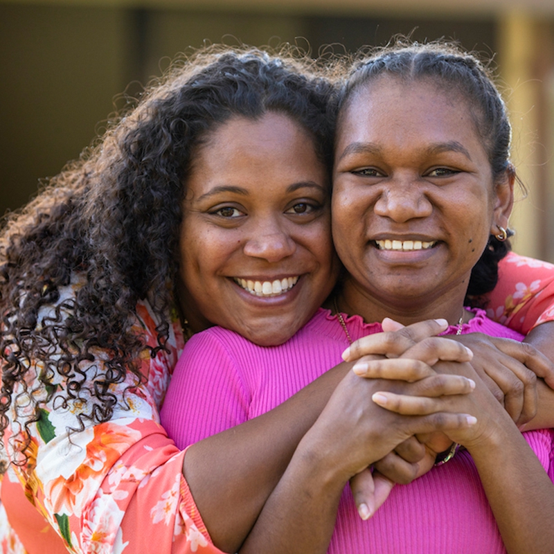 Black woman hugging her friend