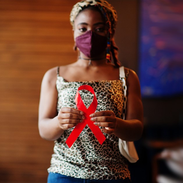 Black woman with an HIV ribbon